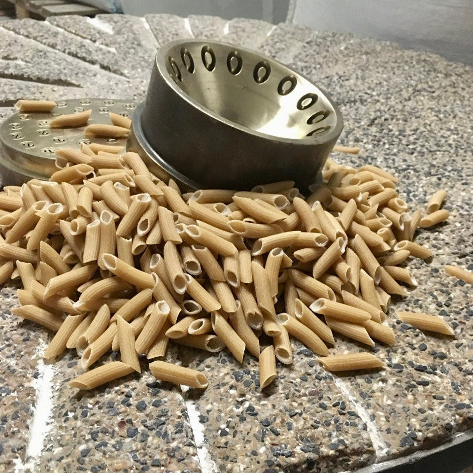 Bronze die, stone mill, and pasta.